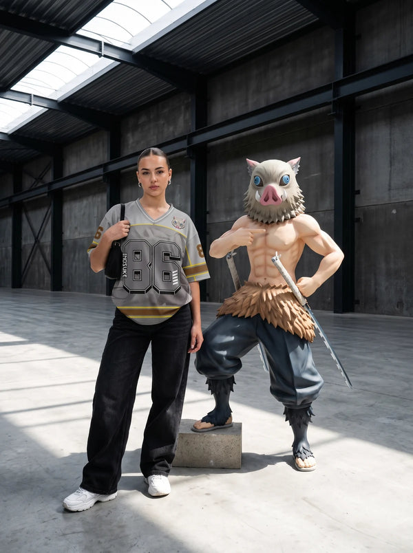 Woman wearing the Inosuke Hashibira grey anime football jersey